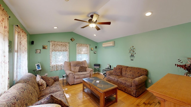 77 Bassett Rd, North Haven, CT 06473 - living area with a wall mounted AC, ceiling fan, lofted ceiling, and wood finished floors