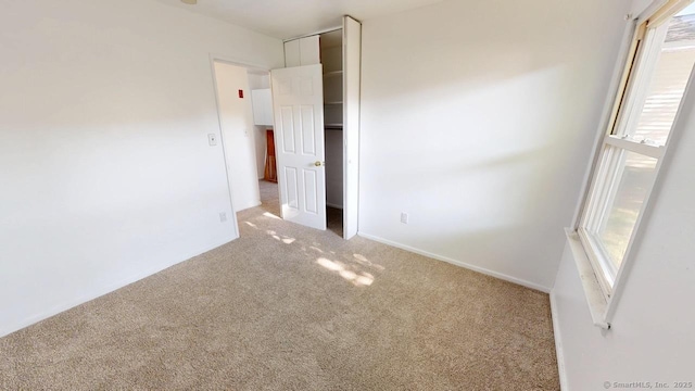 77 Bassett Rd, North Haven, CT 06473 - unfurnished bedroom featuring carpet and baseboards