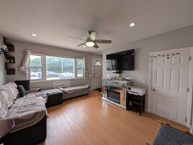 94 Canterbury Rd Unit D, Plainfield, CT 06374 - living room featuring light wood-style floors, ceiling fan, recessed lighting, and a textured ceiling