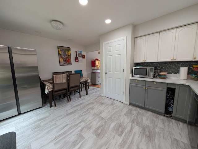 94 Canterbury Rd Unit D, Plainfield, CT 06374 - kitchen featuring stainless steel appliances, gray cabinetry, tasteful backsplash, white cabinetry, and recessed lighting