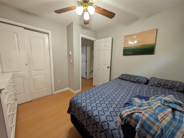 94 Canterbury Rd Unit D, Plainfield, CT 06374 - bedroom featuring light wood-style floors, ceiling fan, a textured ceiling, and baseboards