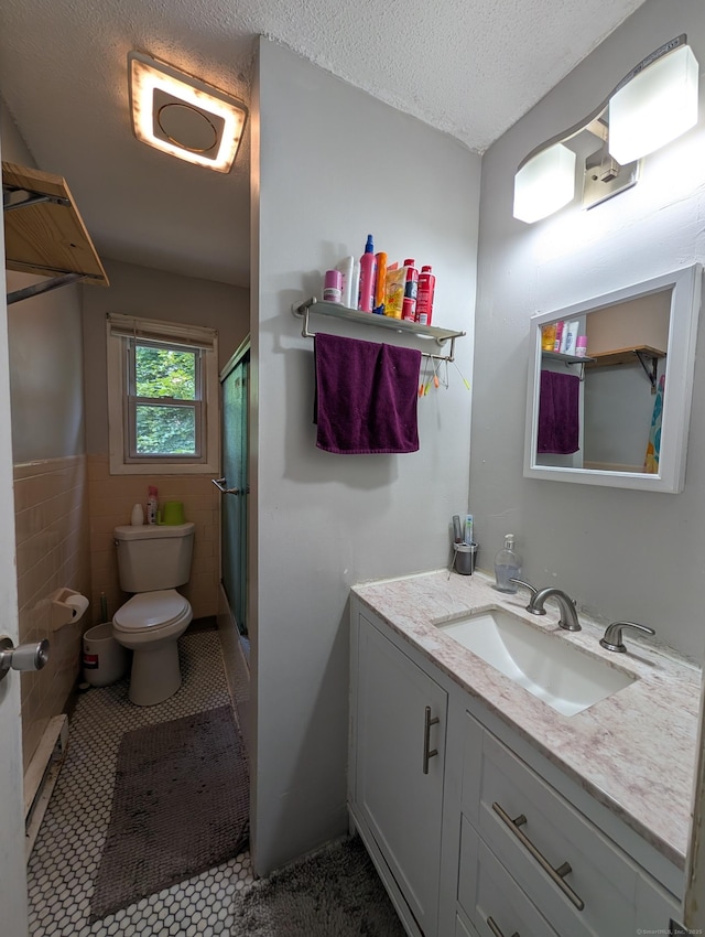 94 Canterbury Rd Unit D, Plainfield, CT 06374 - bathroom with toilet, vanity, a shower with shower door, tile patterned flooring, and a textured ceiling