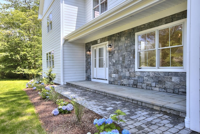 59 Thornhill Rd, Fairfield, CT 06824 - property entrance featuring stone siding and a yard