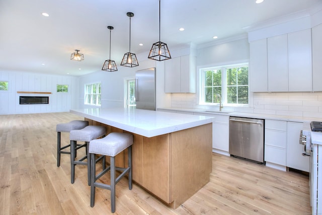 59 Thornhill Rd, Fairfield, CT 06824 - kitchen with appliances with stainless steel finishes, a sink, plenty of natural light, light wood-type flooring, and recessed lighting