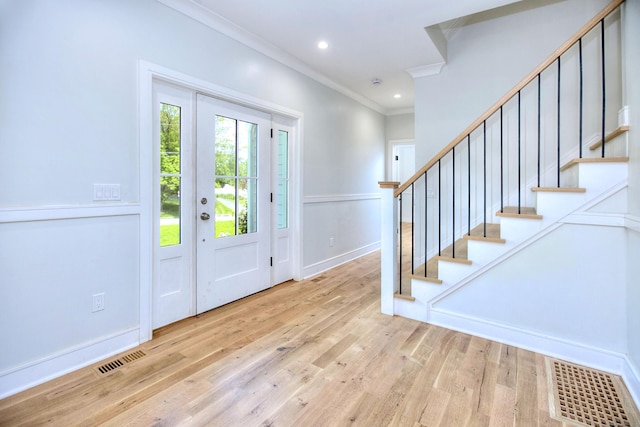 59 Thornhill Rd, Fairfield, CT 06824 - entrance foyer with crown molding, stairway, light wood finished floors, baseboards, and recessed lighting