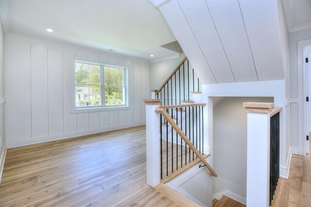59 Thornhill Rd, Fairfield, CT 06824 - staircase featuring wood finished floors, a decorative wall, baseboards, and ornamental molding