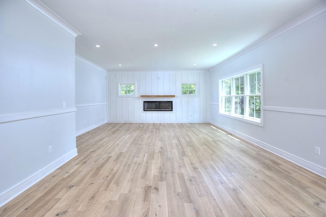 59 Thornhill Rd, Fairfield, CT 06824 - unfurnished living room featuring ornamental molding, a glass covered fireplace, light wood-style floors, baseboards, and recessed lighting