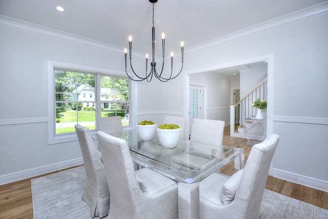 59 Thornhill Rd, Fairfield, CT 06824 - dining room with a chandelier, light wood finished floors, stairs, and ornamental molding