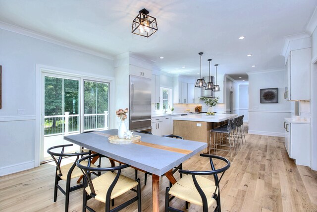59 Thornhill Rd, Fairfield, CT 06824 - dining area featuring light wood-type flooring, ornamental molding, and recessed lighting