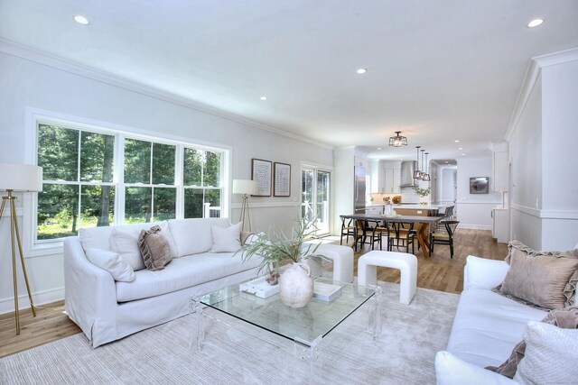 59 Thornhill Rd, Fairfield, CT 06824 - living room featuring plenty of natural light, ornamental molding, light wood-style floors, and recessed lighting