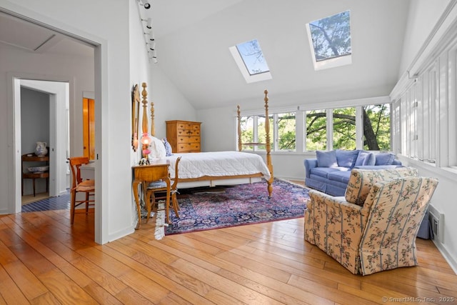 159 Mountain Rd, Ridgefield, CT 06877 - bedroom featuring light wood-style flooring, vaulted ceiling, a skylight, and baseboards