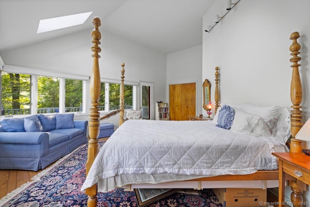 159 Mountain Rd, Ridgefield, CT 06877 - bedroom featuring high vaulted ceiling, a skylight, multiple windows, and wood finished floors