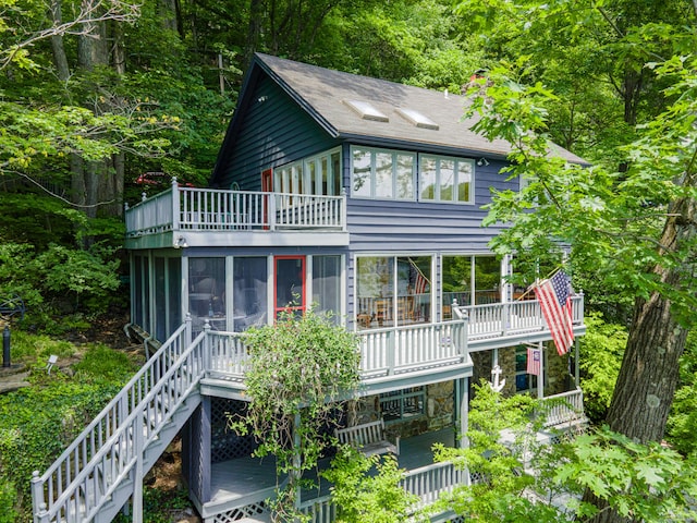159 Mountain Rd, Ridgefield, CT 06877 - back of house with a balcony, a sunroom, stairway, and roof with shingles