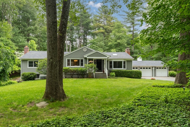 15 Hallsey Ln, Woodbridge, CT 06525 - view of front facade with a front yard, a chimney, concrete driveway, an attached garage, and view of wooded area