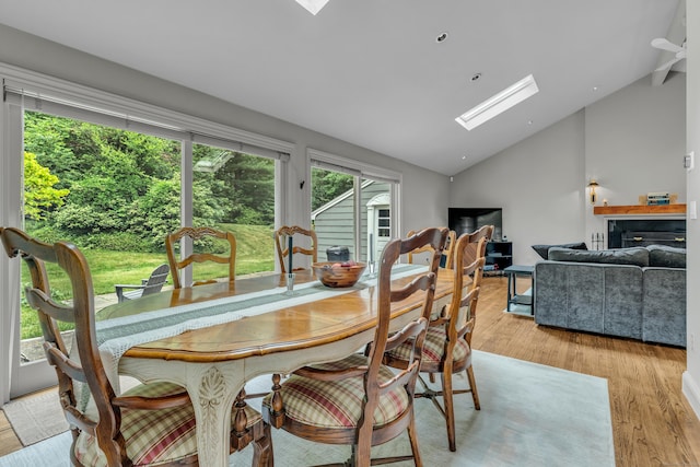 15 Hallsey Ln, Woodbridge, CT 06525 - dining room with a skylight, light wood-type flooring, and high vaulted ceiling