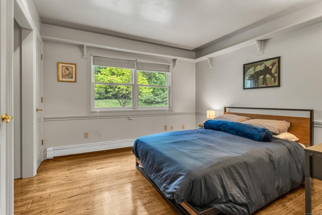 15 Hallsey Ln, Woodbridge, CT 06525 - bedroom with baseboard heating and wood finished floors