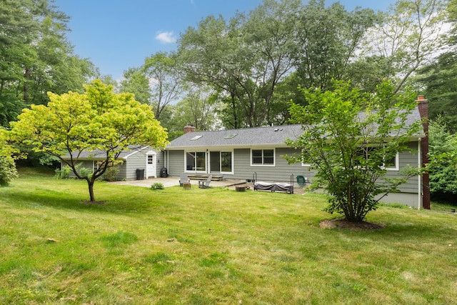 15 Hallsey Ln, Woodbridge, CT 06525 - back of house with a patio, a chimney, and a yard
