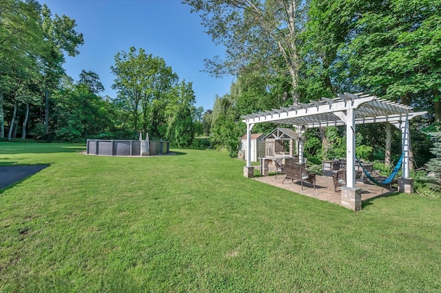 6 Victoria Rd, Portland, CT 06480 - view of grassy yard with a pergola, an outdoor pool, a patio area, and view of wooded area