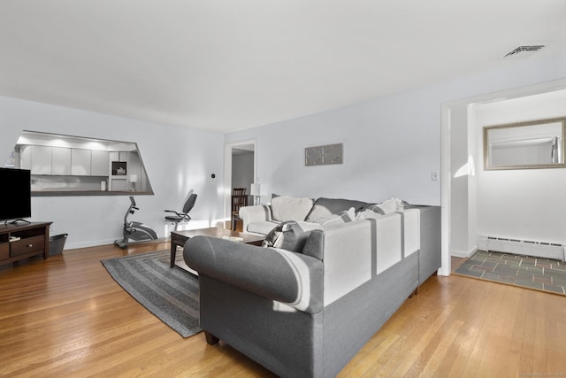 7 Lorma Ave, Trumbull, CT 06611 - living room with baseboard heating and light wood-style flooring