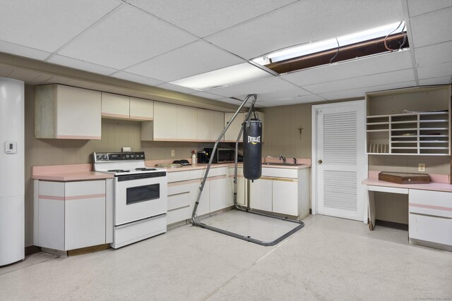 7 Lorma Ave, Trumbull, CT 06611 - kitchen with white electric range, a drop ceiling, and light countertops