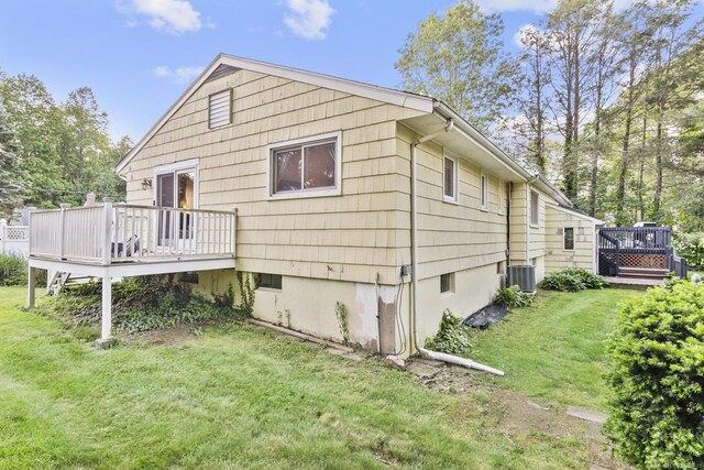 7 Lorma Ave, Trumbull, CT 06611 - rear view of house featuring a deck, a yard, and central AC