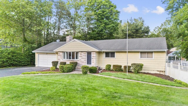 7 Lorma Ave, Trumbull, CT 06611 - ranch-style house featuring driveway, a chimney, an attached garage, and stone siding