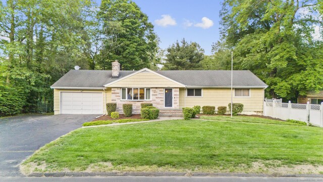 7 Lorma Ave, Trumbull, CT 06611 - ranch-style home featuring a chimney, driveway, and a garage