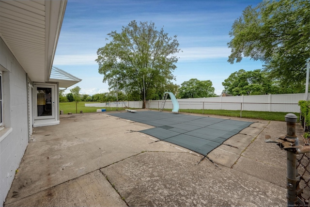 34 River St, East Haven, CT 06512 - view of swimming pool with a water slide, a patio, and a fenced backyard