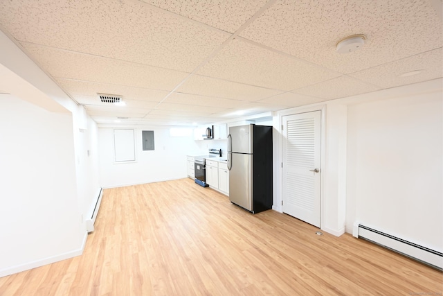 34 River St, East Haven, CT 06512 - finished below grade area with freestanding refrigerator, baseboard heating, light wood-style floors, a drop ceiling, and a baseboard radiator