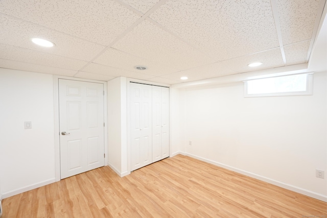34 River St, East Haven, CT 06512 - below grade area featuring light wood-type flooring, a paneled ceiling, recessed lighting, and baseboards