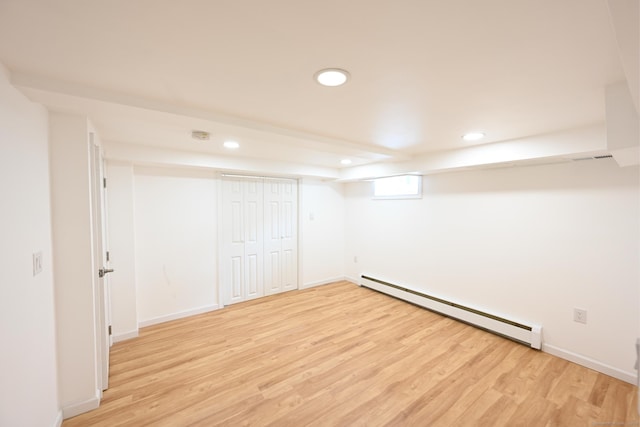 34 River St, East Haven, CT 06512 - below grade area featuring a baseboard radiator, light wood-style floors, recessed lighting, and baseboards