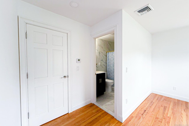 34 River St, East Haven, CT 06512 - hallway featuring light wood-style floors and baseboards