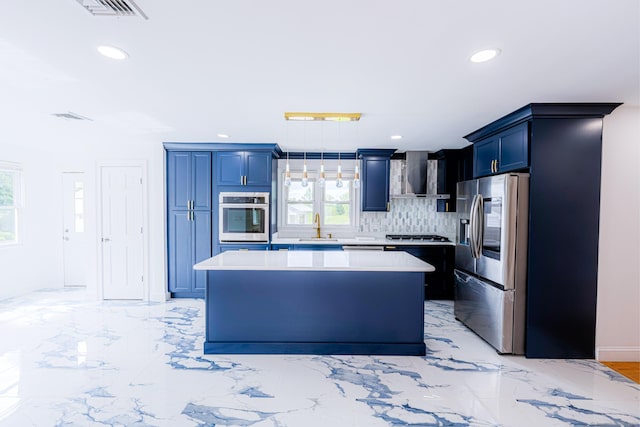 34 River St, East Haven, CT 06512 - kitchen featuring appliances with stainless steel finishes, wall chimney exhaust hood, blue cabinetry, a kitchen island, and recessed lighting