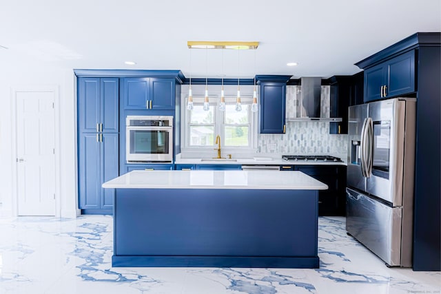 34 River St, East Haven, CT 06512 - kitchen with stainless steel appliances, wall chimney range hood, a sink, blue cabinets, and a kitchen island