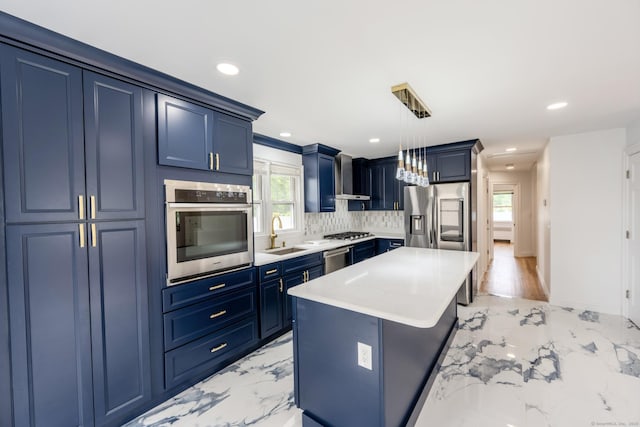 34 River St, East Haven, CT 06512 - kitchen featuring appliances with stainless steel finishes, blue cabinetry, light marble finish flooring, a sink, and recessed lighting