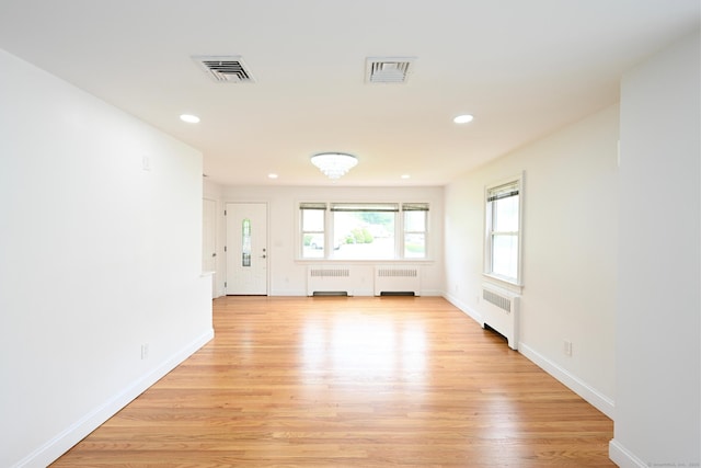 34 River St, East Haven, CT 06512 - unfurnished room featuring radiator, light wood-type flooring, baseboards, and recessed lighting