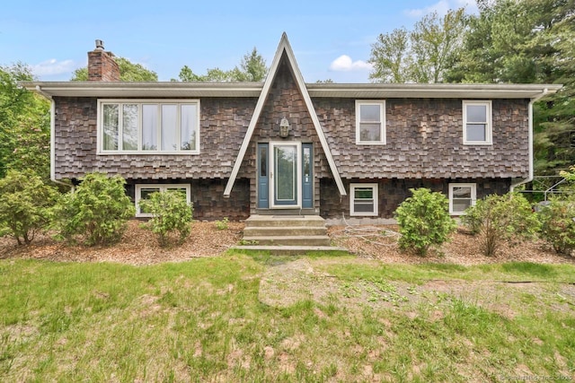18 Robbie Rd, East Haddam, CT 06469 - view of front of property featuring a chimney and a front lawn