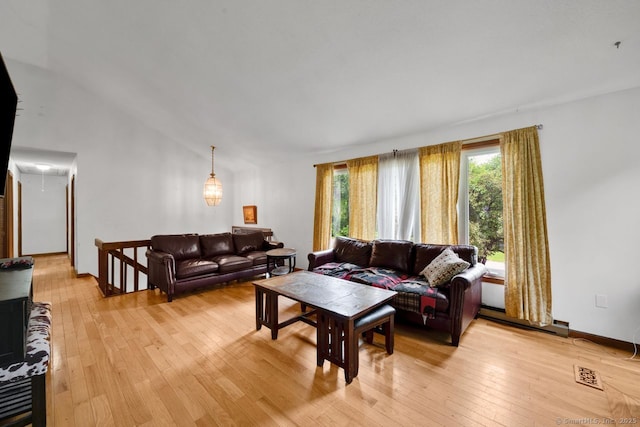 18 Robbie Rd, East Haddam, CT 06469 - living area with light wood-style floors, baseboard heating, attic access, and vaulted ceiling
