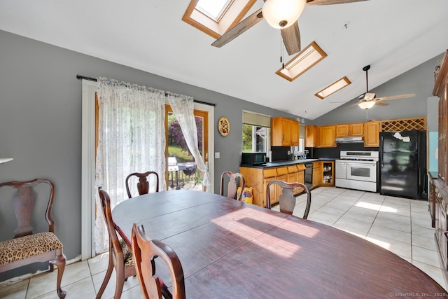 18 Robbie Rd, East Haddam, CT 06469 - dining space with a skylight, ceiling fan, vaulted ceiling, and light tile patterned flooring