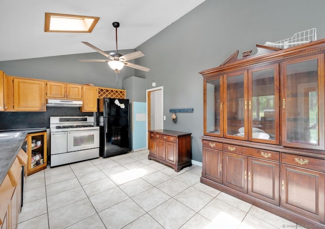 18 Robbie Rd, East Haddam, CT 06469 - kitchen with gas range, freestanding refrigerator, high vaulted ceiling, under cabinet range hood, and ceiling fan