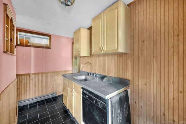 18 Robbie Rd, East Haddam, CT 06469 - kitchen featuring a sink, light brown cabinetry, baseboard heating, wooden walls, and dark tile patterned flooring
