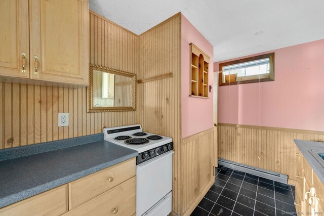 18 Robbie Rd, East Haddam, CT 06469 - kitchen featuring white electric range, baseboard heating, light brown cabinetry, wainscoting, and dark tile patterned flooring