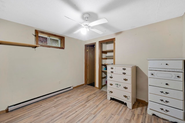 18 Robbie Rd, East Haddam, CT 06469 - bedroom with a baseboard radiator, light wood finished floors, a ceiling fan, and baseboards