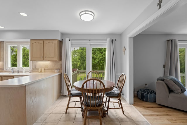 dining area with recessed lighting and light tile patterned floors
