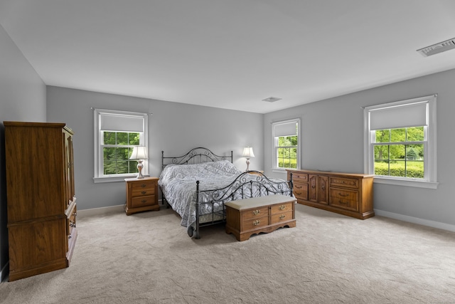 carpeted bedroom with baseboards