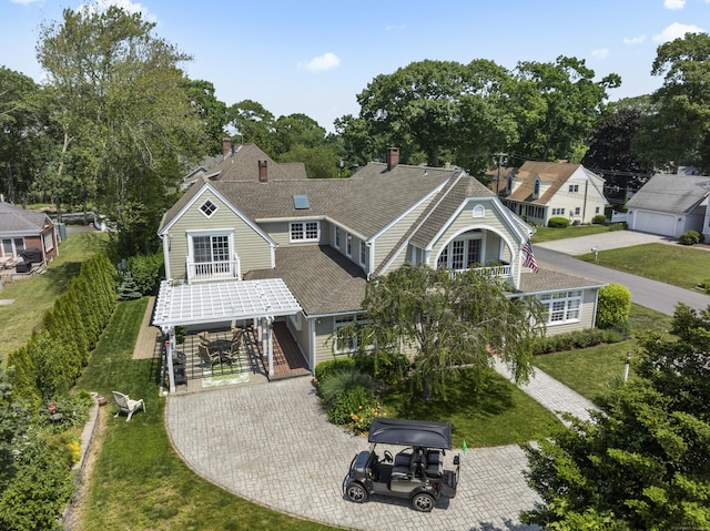 5 Oakwood Rd, Old Saybrook, CT 06475 - view of front facade featuring driveway, a front lawn, stairway, and roof with shingles