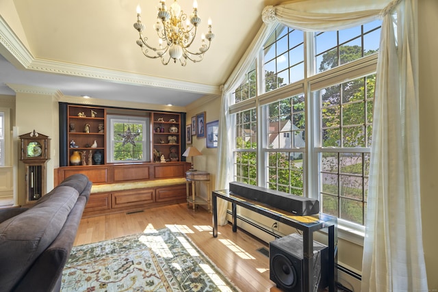 5 Oakwood Rd, Old Saybrook, CT 06475 - sitting room with ornamental molding, a chandelier, light wood-style flooring, and baseboard heating