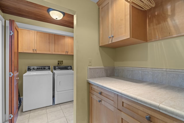 5 Oakwood Rd, Old Saybrook, CT 06475 - laundry room with washer and clothes dryer, light tile patterned floors, and cabinet space