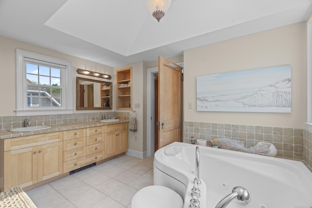 5 Oakwood Rd, Old Saybrook, CT 06475 - full bathroom featuring double vanity, a whirlpool tub, tasteful backsplash, and tile patterned flooring