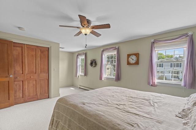 5 Oakwood Rd, Old Saybrook, CT 06475 - bedroom with baseboard heating, multiple windows, light colored carpet, and ceiling fan